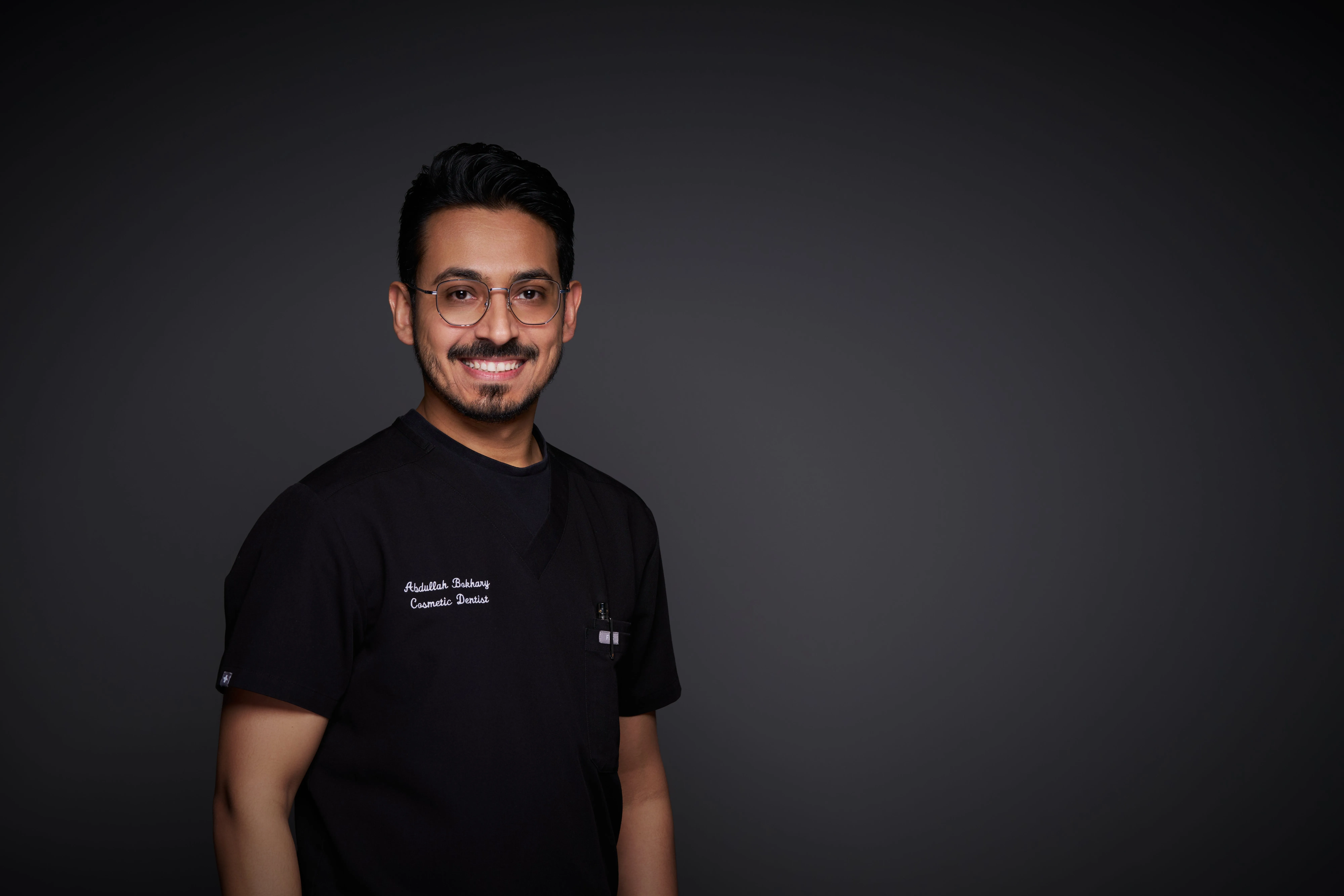 Dr. Abdullah Bokhary in clinical scrubs